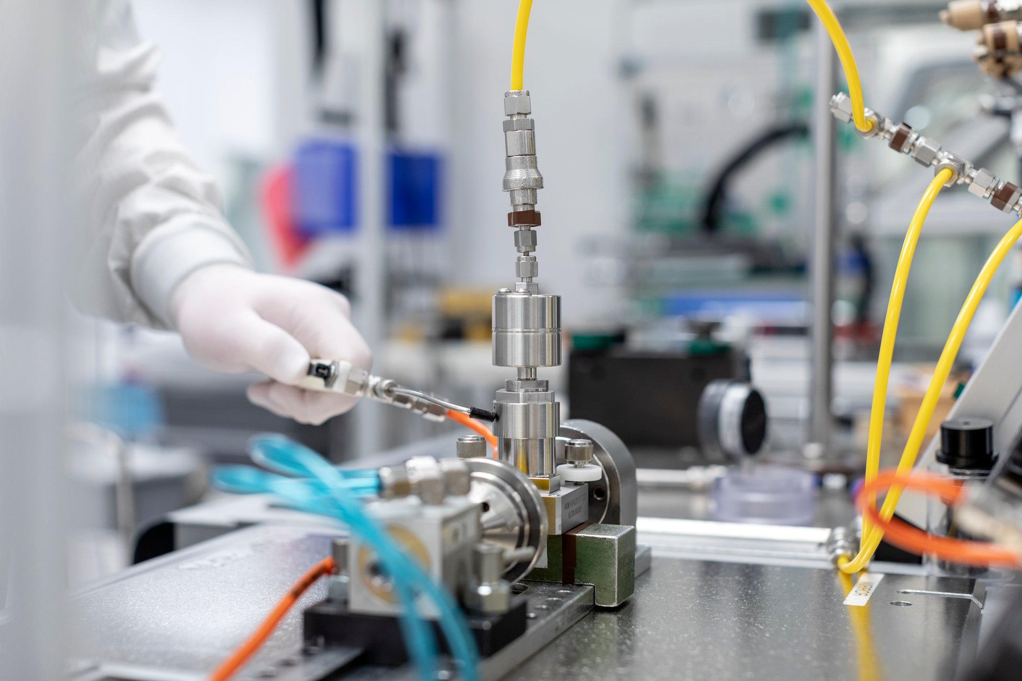 Cleanroom associate inspecting critical components to support reliable system performance and reduce unplanned downtime. Cleanroom associate inspecting critical components to support reliable system performance and reduce unplanned downtime.